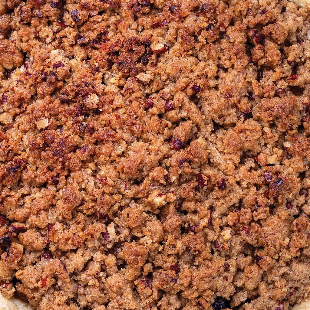 Dark brown mixer cube crumbles with coarse texture close-up