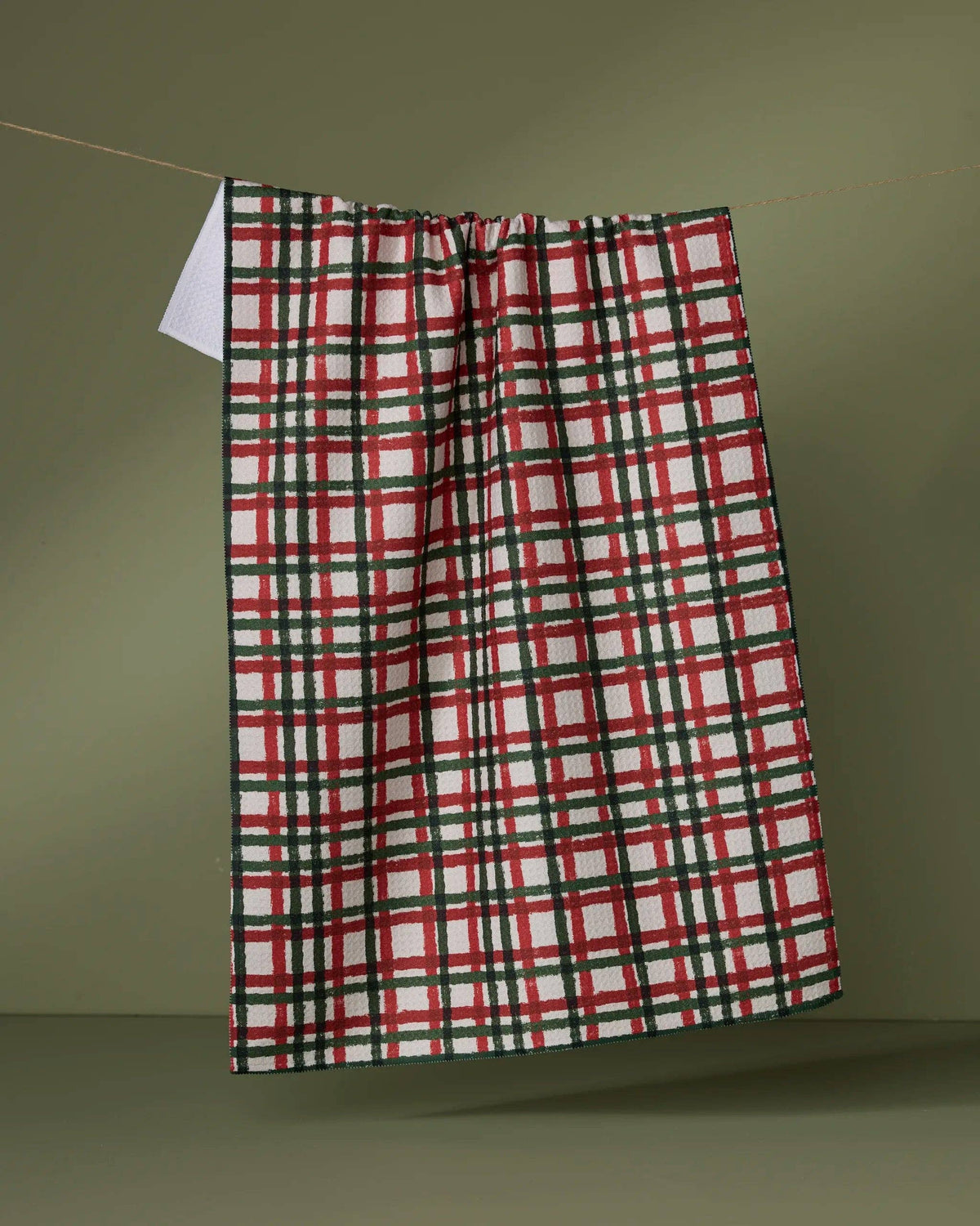 Red, green, and white plaid tea towel with gathered top and hanging loop