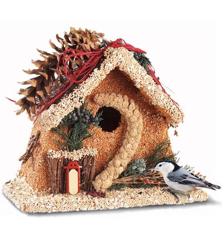 Side view decorative birdhouse ornament with red door, candles, and small bird