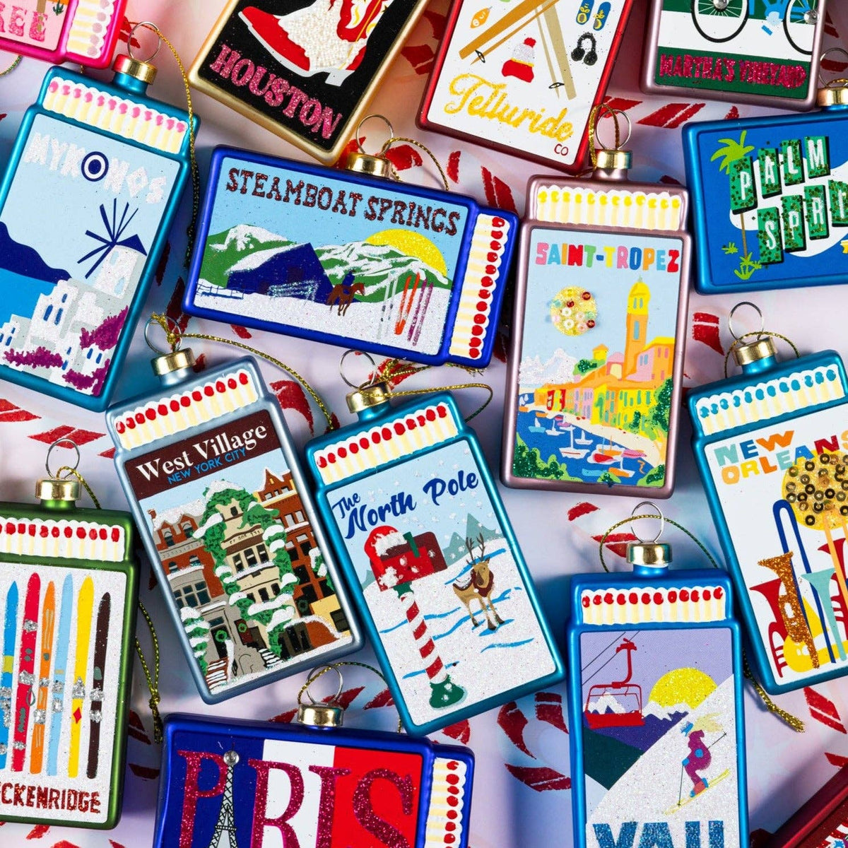 Assorted matchbook ornaments, including a blue "The North Pole" design