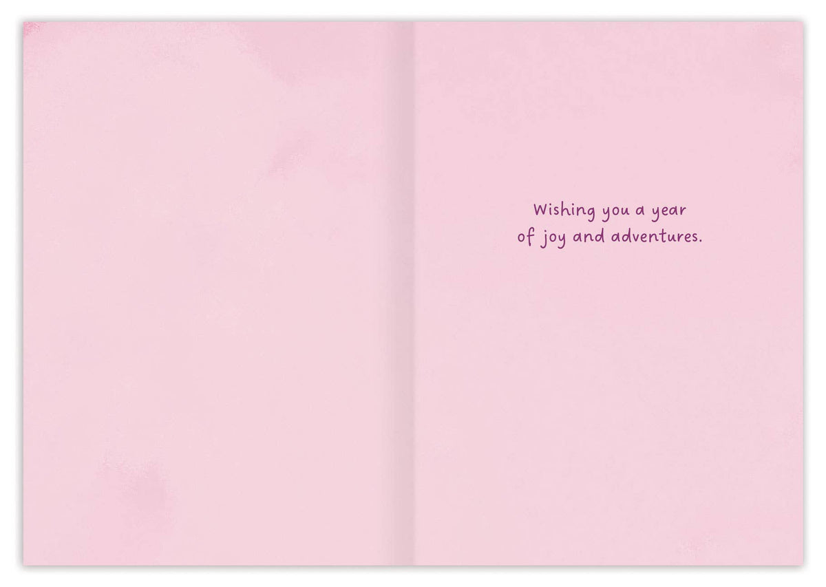 Pink birthday card inside with “Wishing you a year of joy and adventures.”