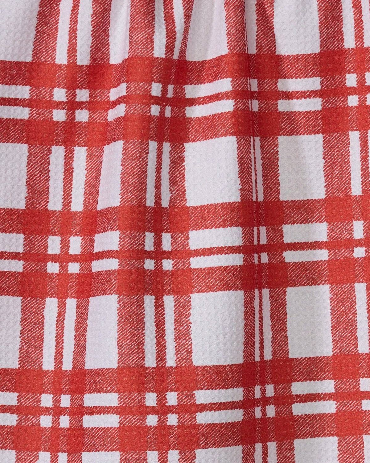Red and white tartan plaid tea towel fabric close-up