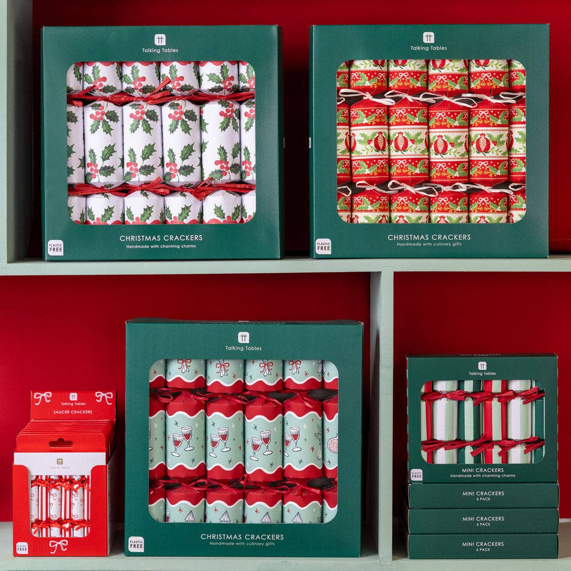 Christmas crackers boxed set with festive front displays and red ribbon-tied contents