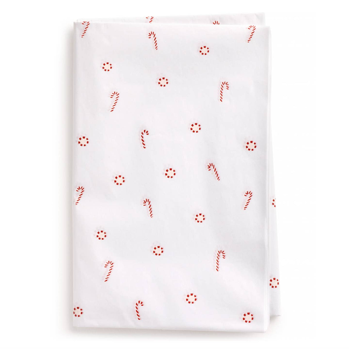 White tissue paper with red peppermint candies and candy cane pattern