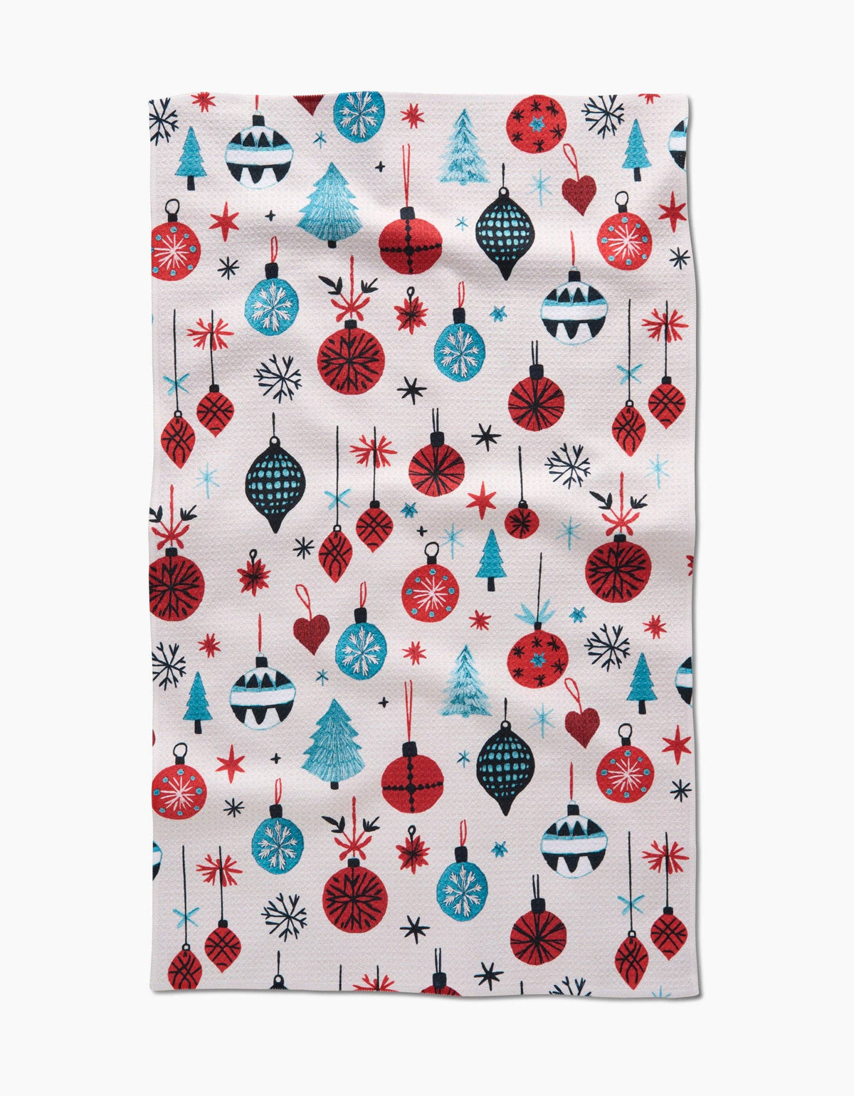 White tea towel with embroidered ornament pattern in red, blue, and black