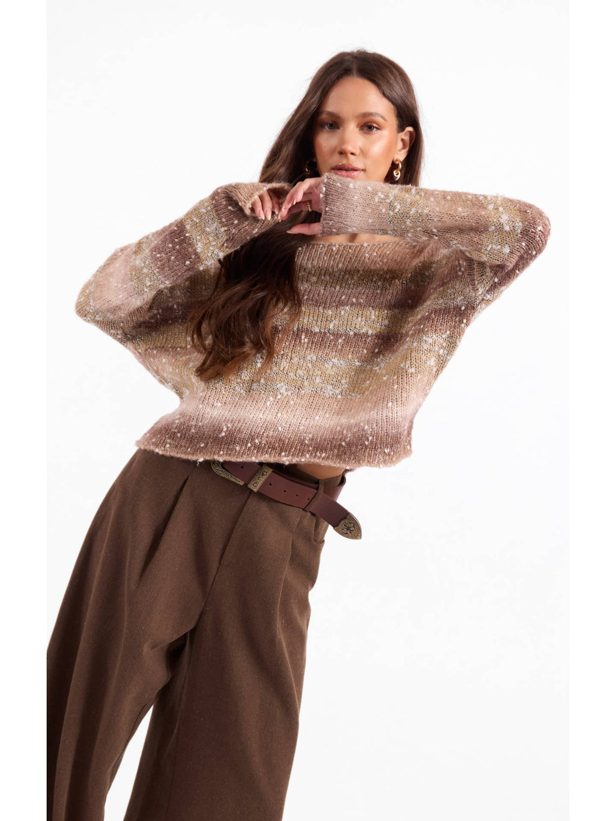 Ombre sparkle knit sweater with crew neck and long sleeves, hands at head