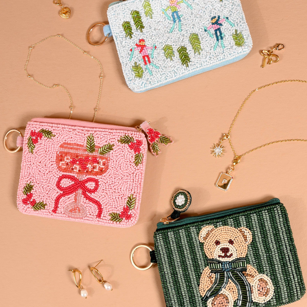 Green striped beaded pouch with teddy bear figure and round clasp ring