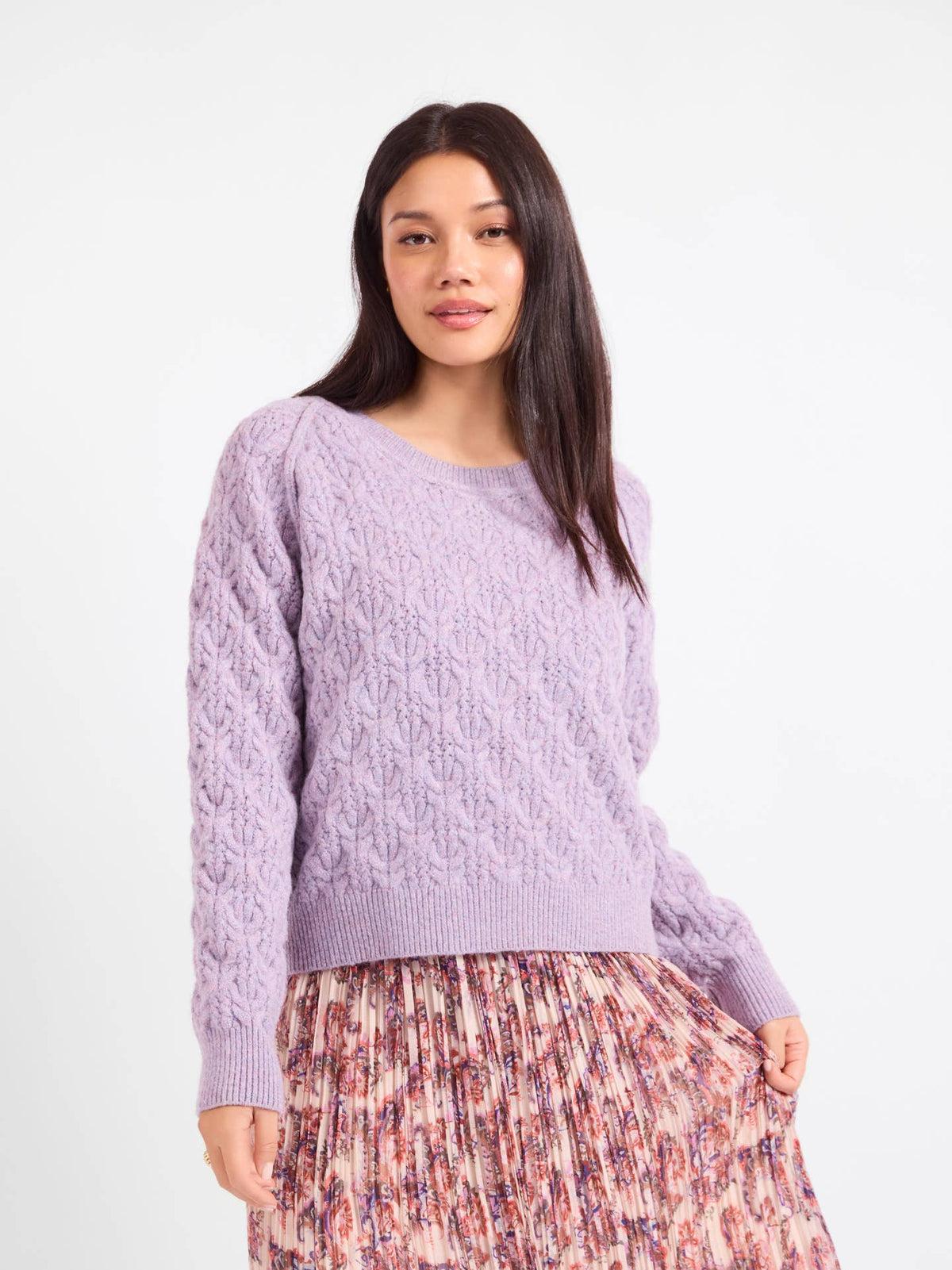 Lavender cable-knit sweater with round crew neck and long sleeves