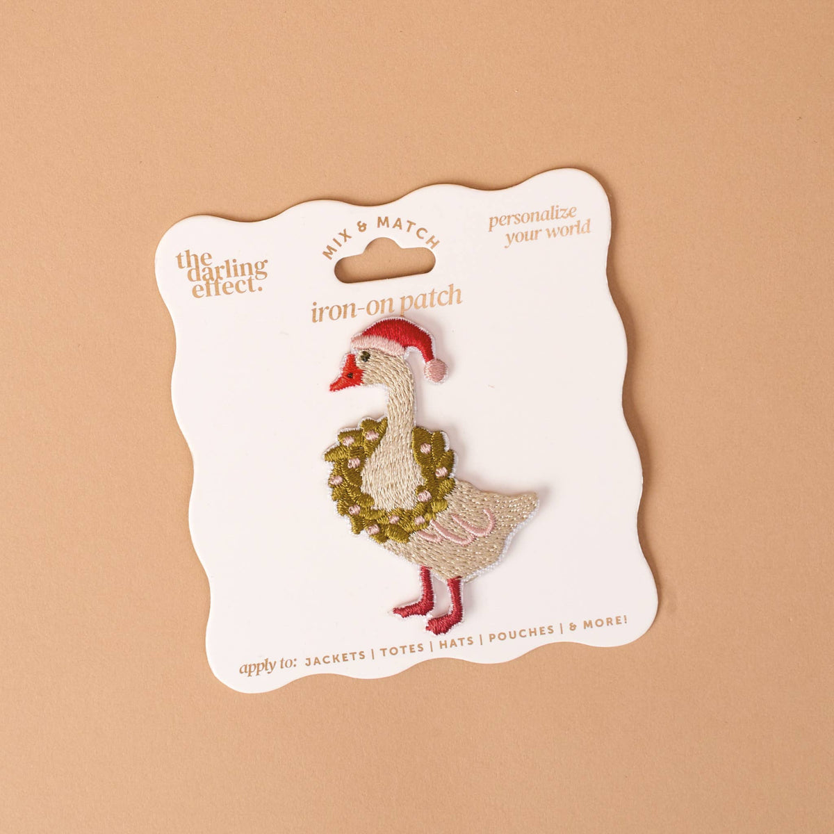 Embroidered iron-on patch: white goose with red Santa hat and gold leafy coat