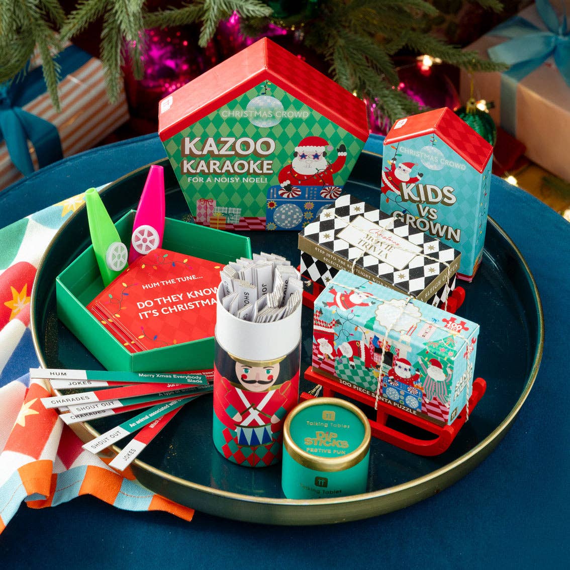 Family Bingo game box among other Christmas gifts on a decorated tray