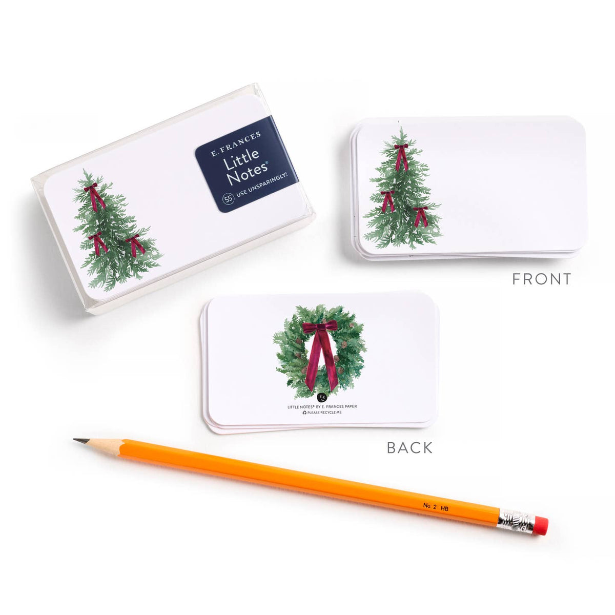 Set of Christmas note cards showing front and back designs with wreath and bow