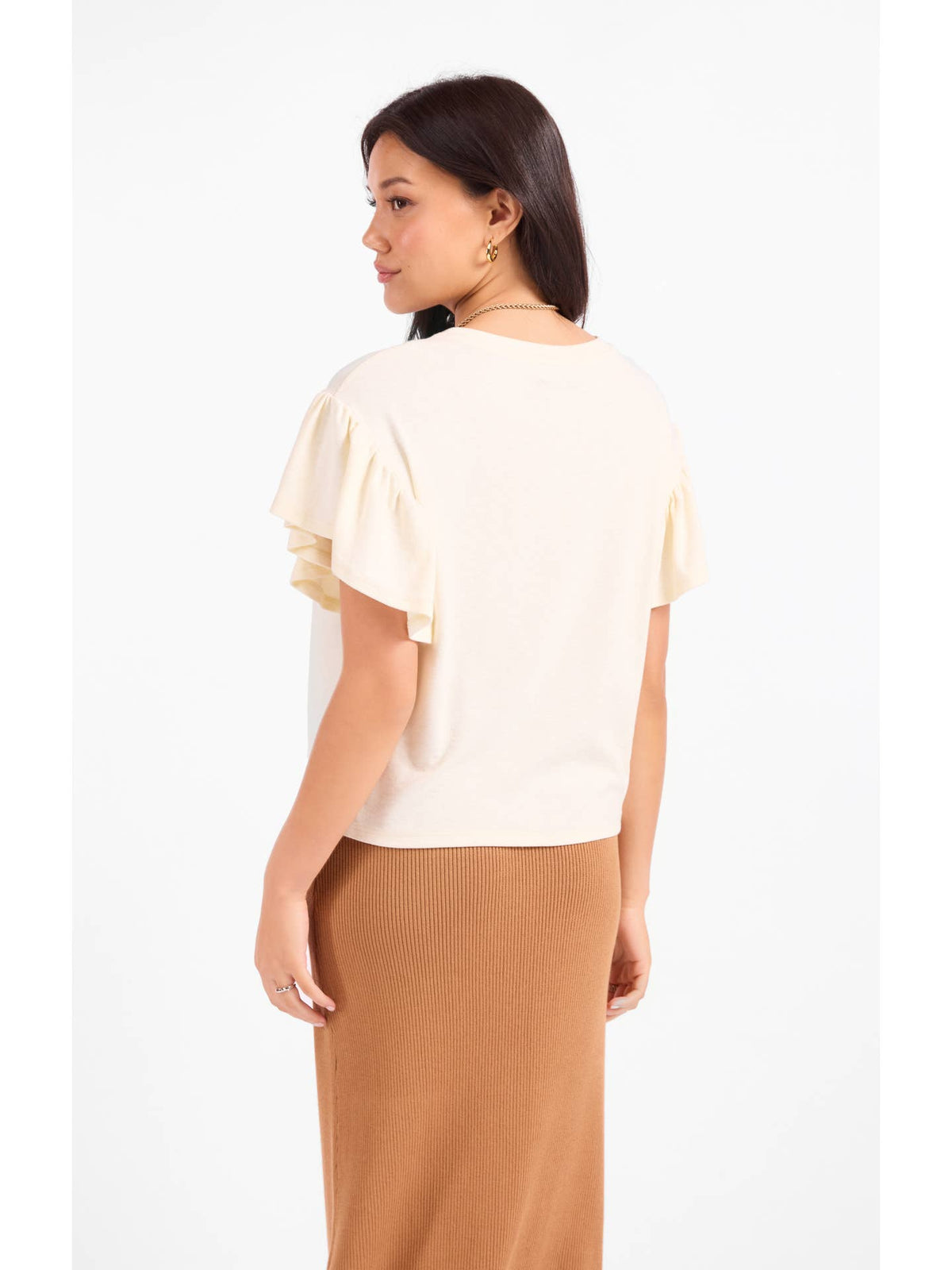 Light cream ruffle sleeve top with short back and draped ruffle tiers