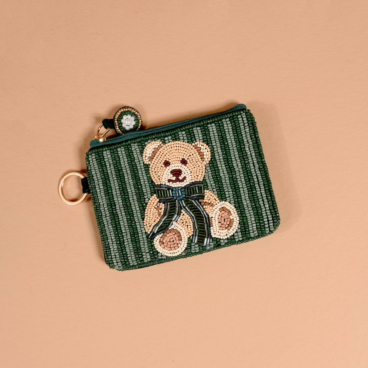 Green striped beaded pouch with teddy bear face and round clasp ring
