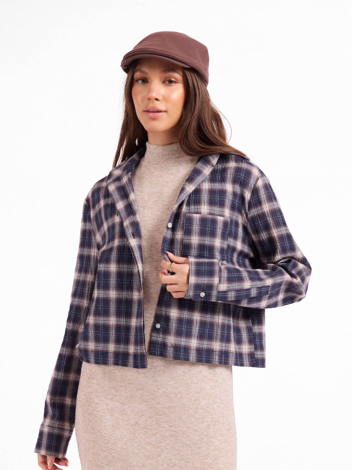 Navy and tan plaid button-up shirt with long sleeves and button front