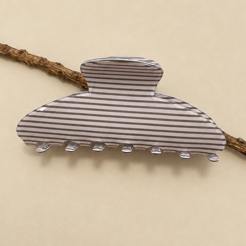 Gray striped oval jumbo hair claw clip with ridged clasp teeth.