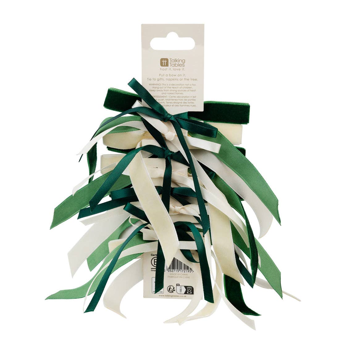 Green and cream velvet bow set with loose ribbon ends on a display card