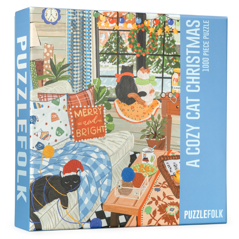 Cozy Cat Christmas 1000-piece puzzle box with holiday room scene and black cat
