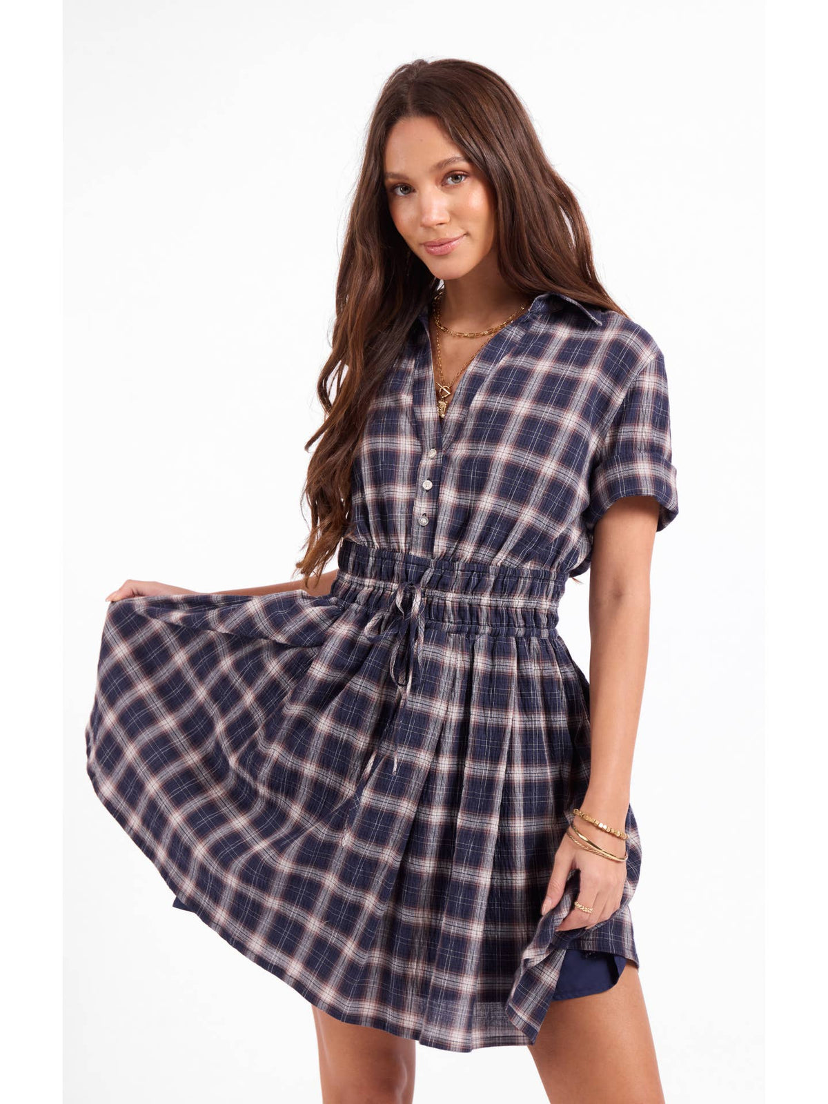 Navy plaid shirt dress with short sleeves, button front, and flared gathered skirt