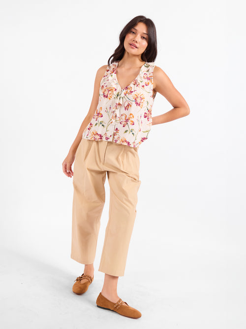 Floral sleeveless V-neck top with button front and ruffled neckline
