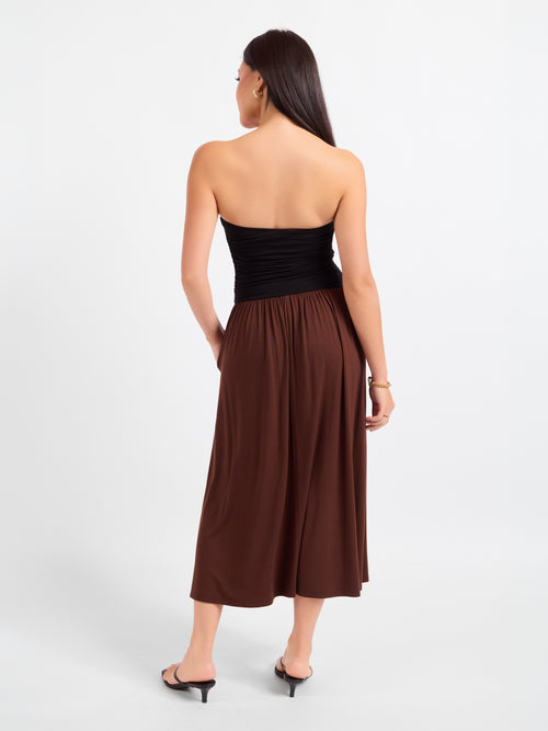 Strapless midi dress back view: black fitted top with brown gathered skirt