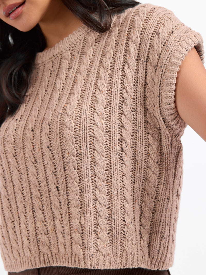 Heathered beige knit sweater tank close-up of cable texture and ribbed neckline
