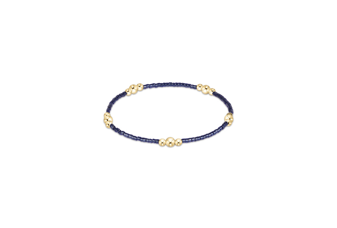 Hope Purpose gold bracelet with navy thread and gold-tone round beads
