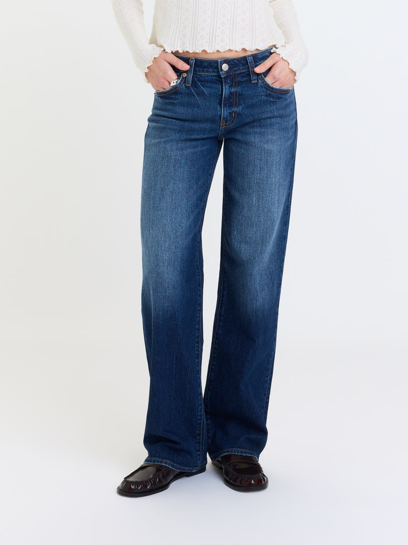 Low-rise straight jeans front with dark blue denim, button-fly and stitched front pockets