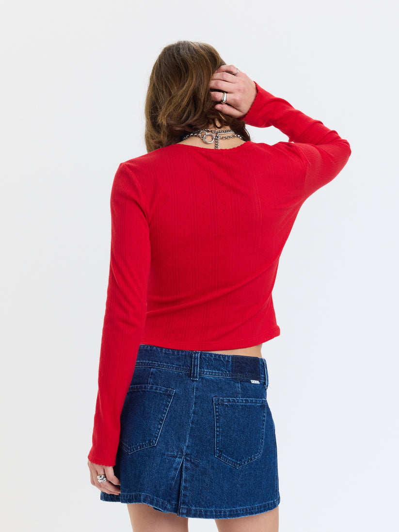 Stargazer pointelle cardigan in bright red, back view with pointelle texture and long sleeves
