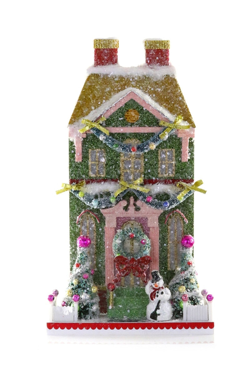 Snowman Manor decorative holiday house ornament, green with snow accents and door figure
