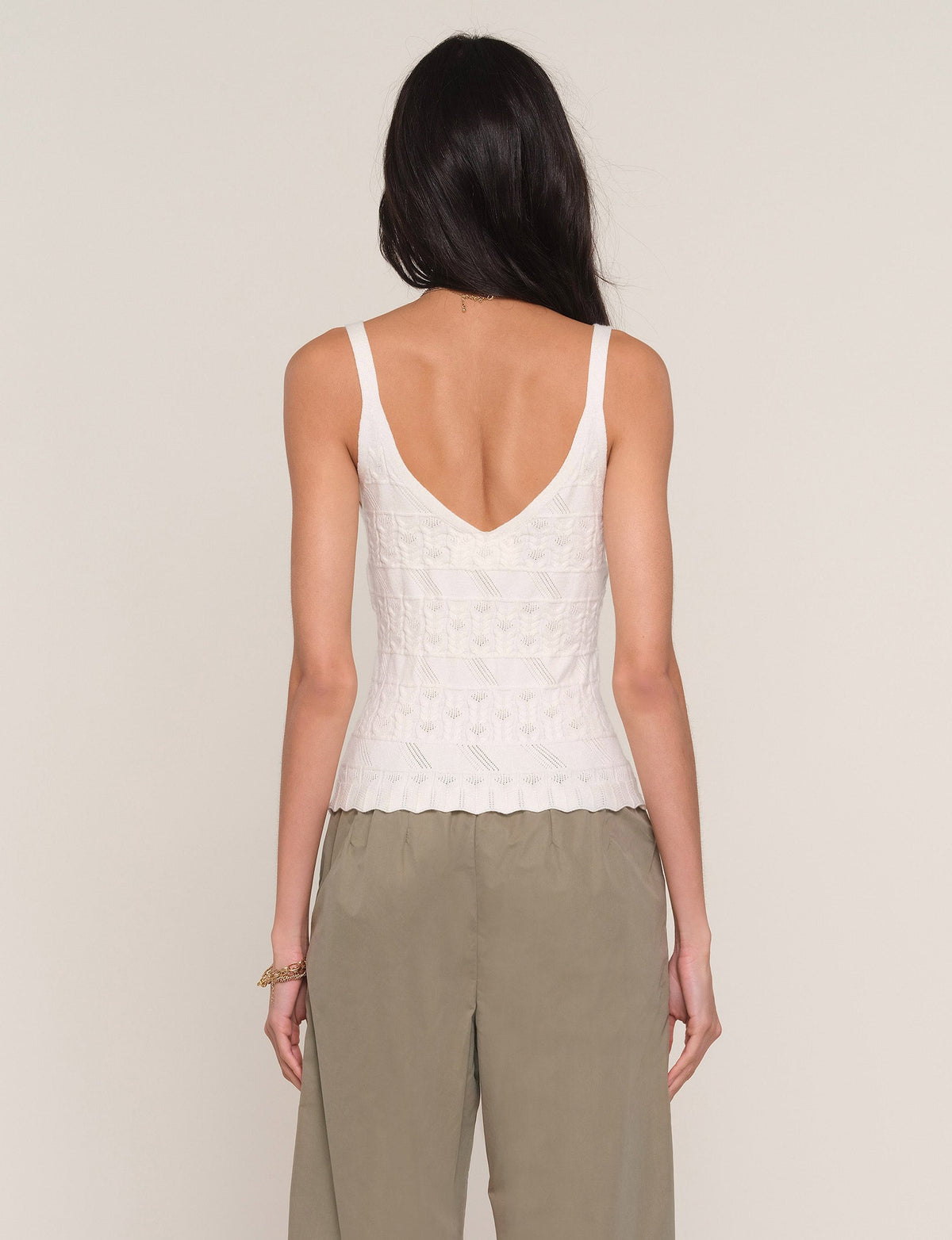 Back of white cami top with V-back neckline and thin shoulder straps