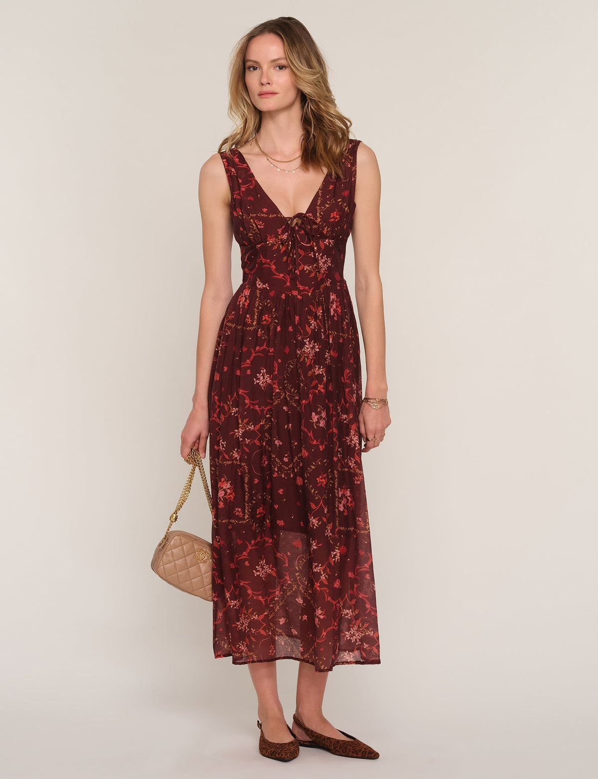 Sleeveless V-neck midi dress in dark burgundy floral print with gathered waist
