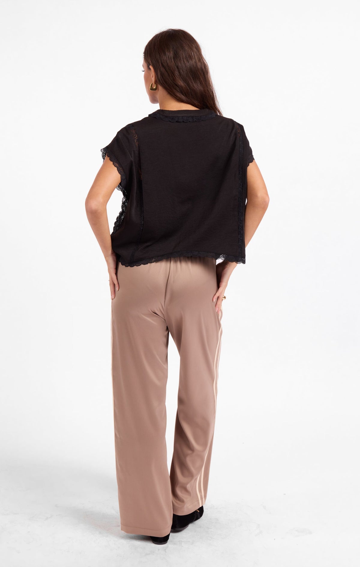 Black short-sleeve top with lace-trimmed back hem