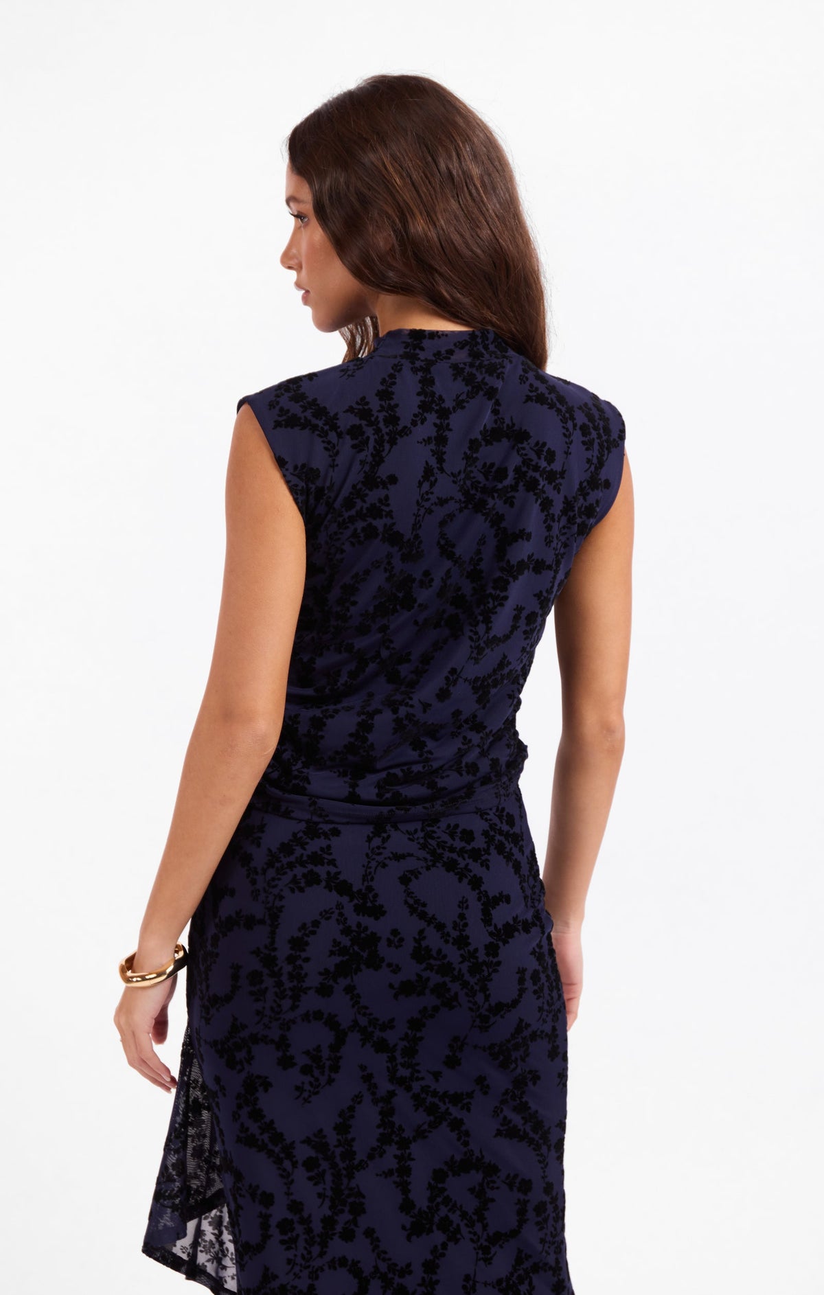 Dark navy sleeveless mesh top with high neck and fitted back, layered hem