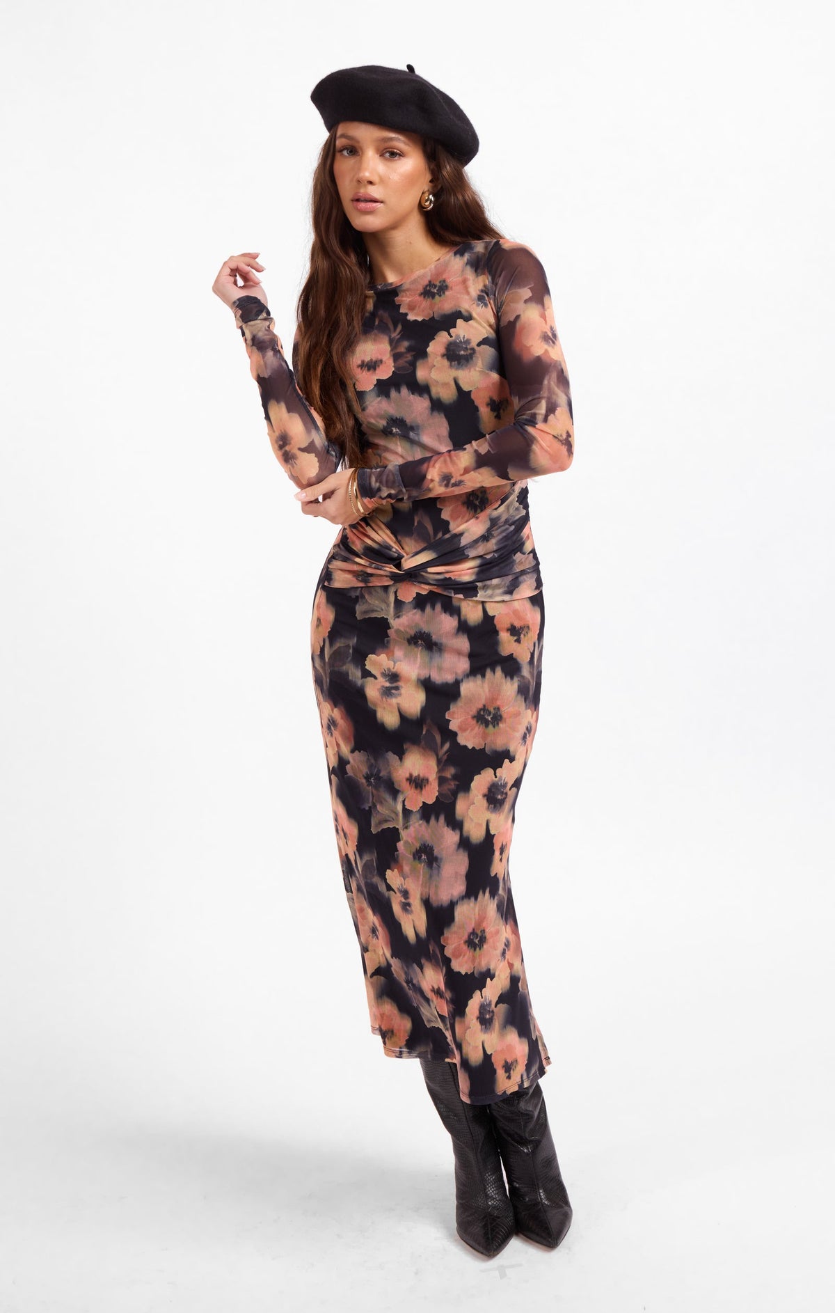 Floral maxi dress with long sleeves and gathered waist tie, front view.