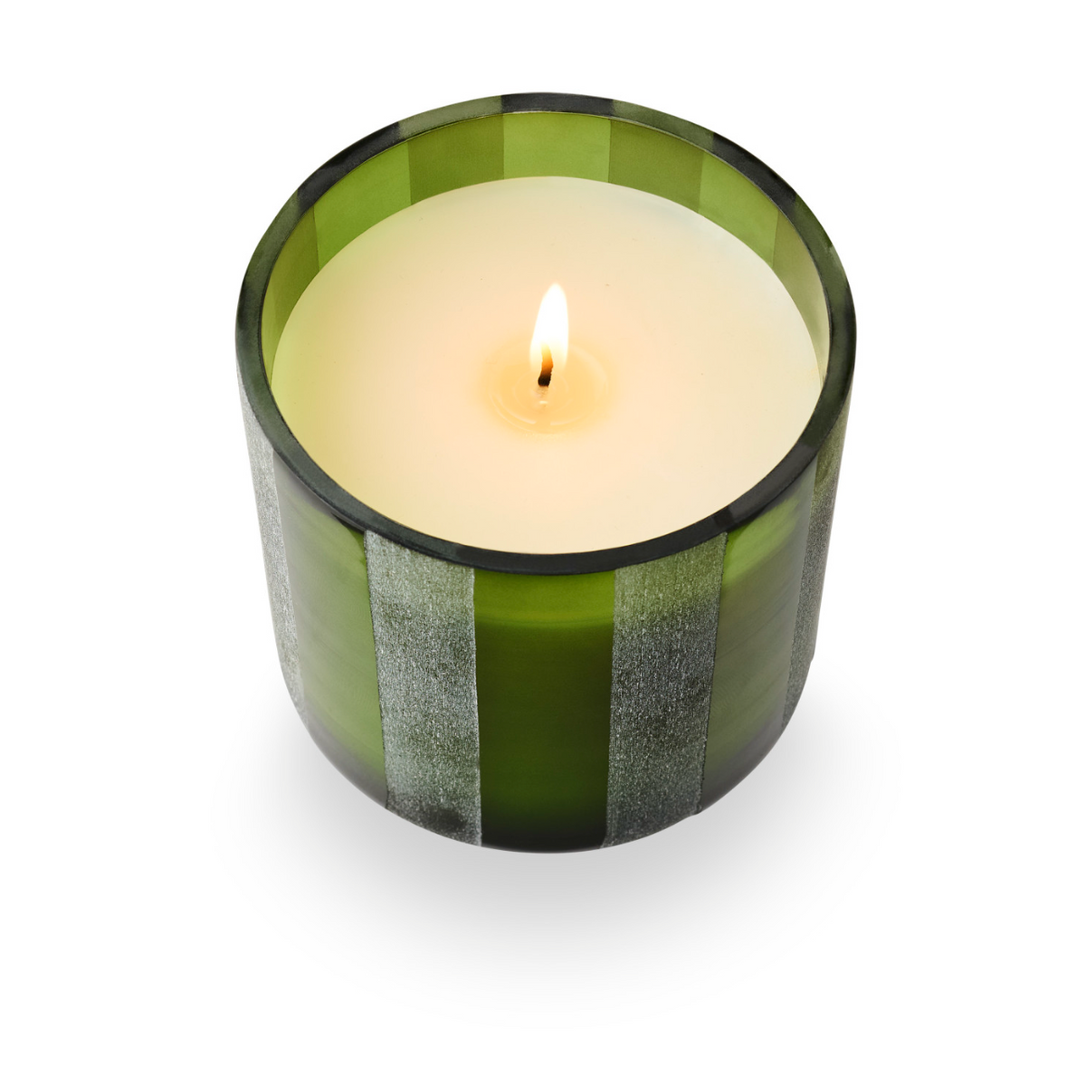 Green etched glass candle with vertical stripes, visible flame, and round white wax top