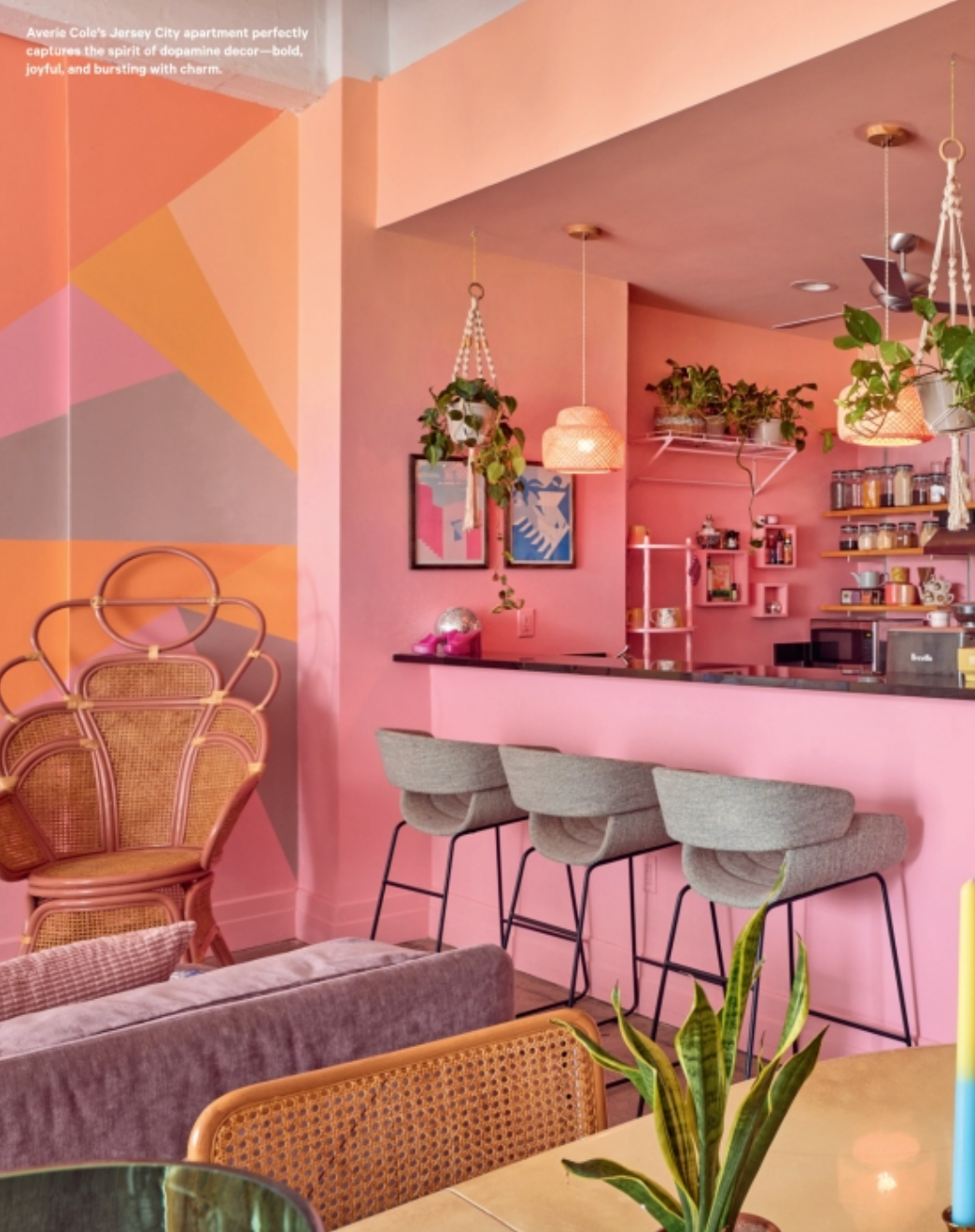 Colorful kitchen and dining area with bar stools, pendant lights, and countertop decor