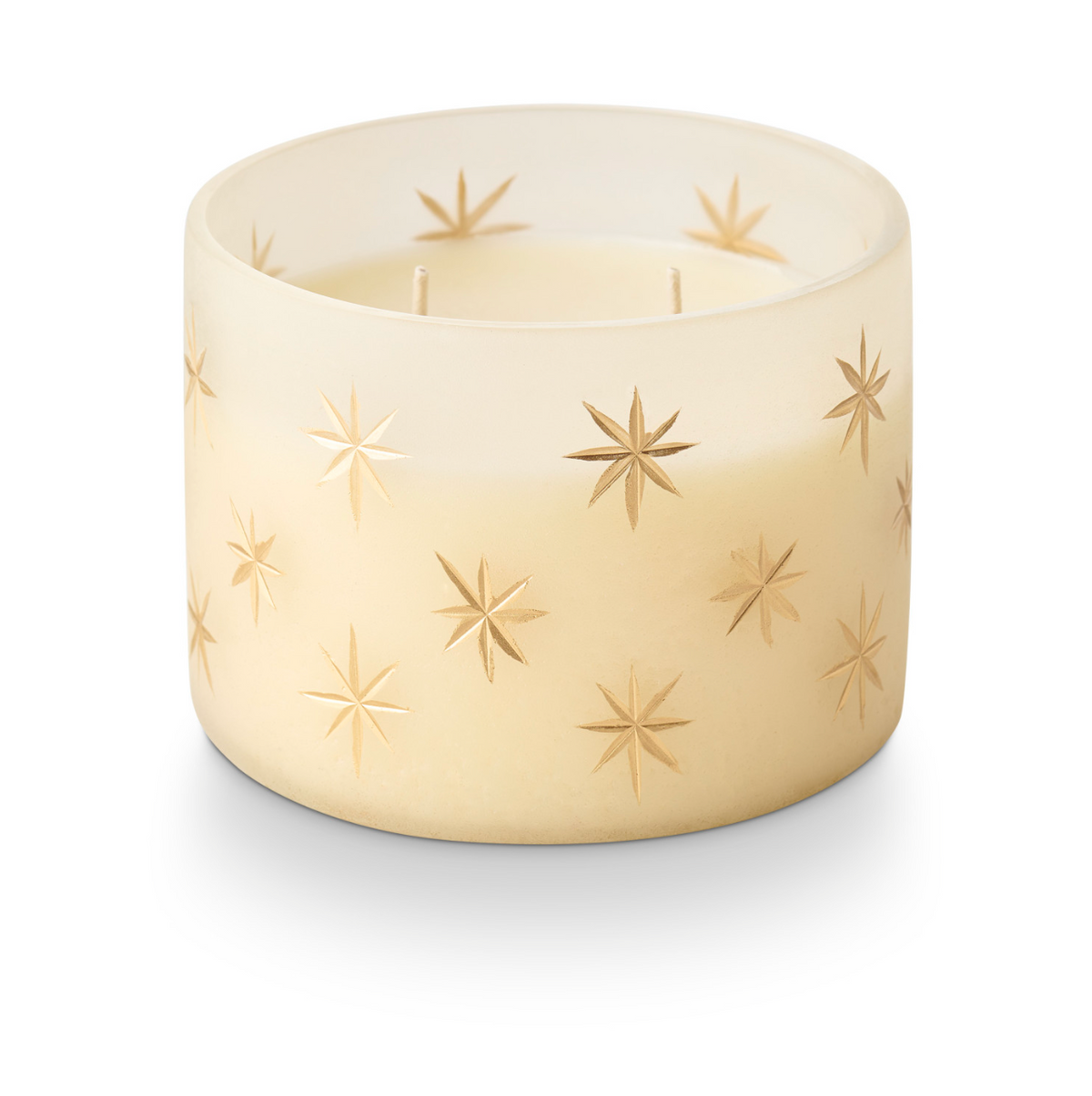 Frosted glass candle holder with gold star pattern and two unlit wicks