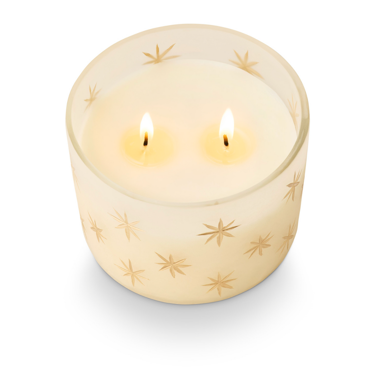 Frosted glass candle holder with gold star pattern and two lit wicks
