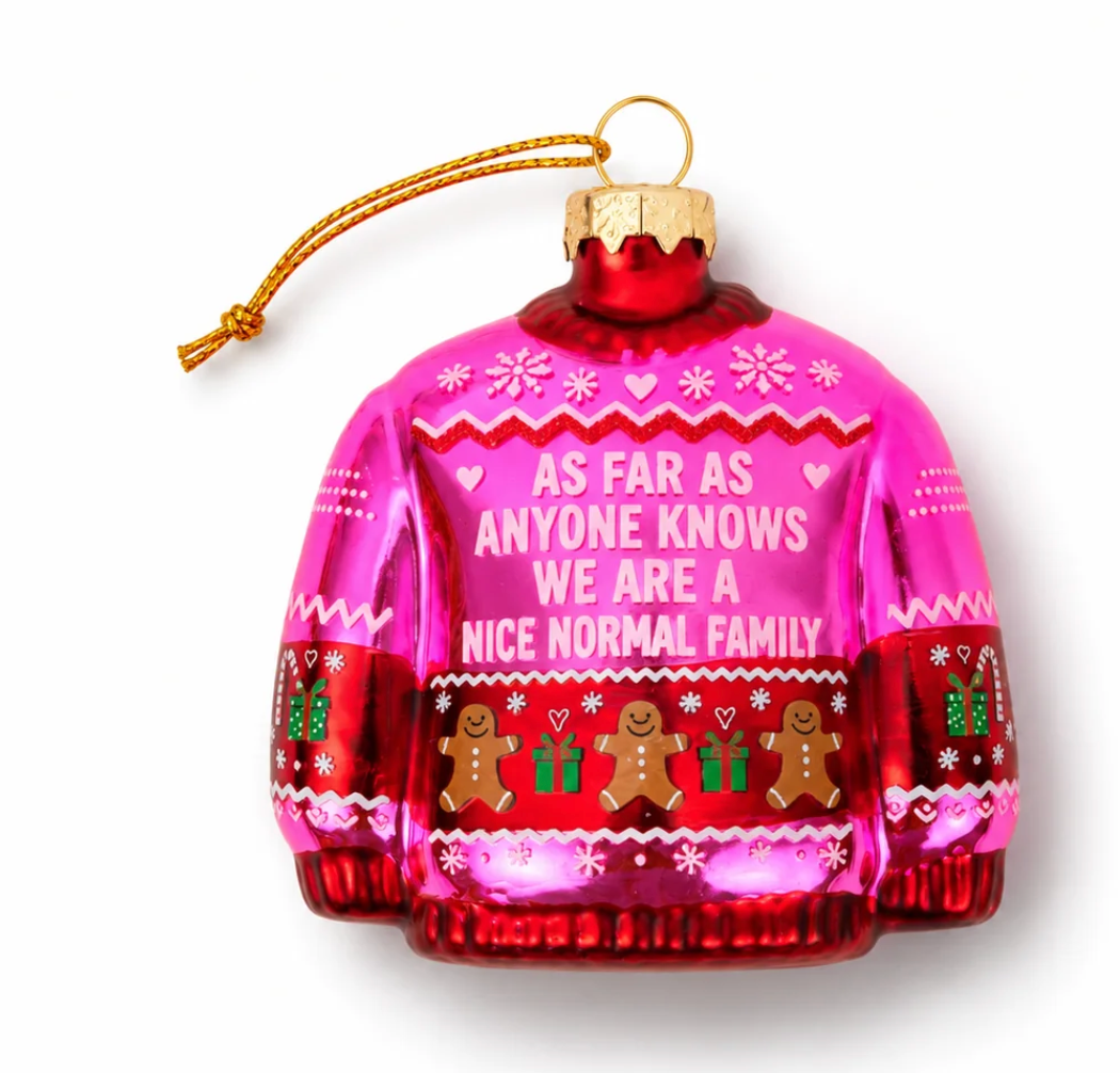 Pink sweater-shaped glass ornament with gingerbread figures and 'Nice Normal Family' quote