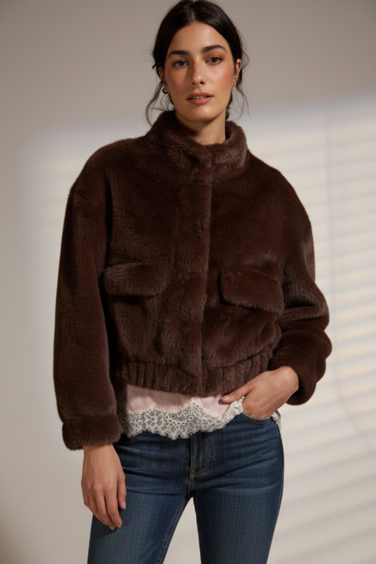 Badet faux fur jacket in dark brown with stand collar and flap pockets