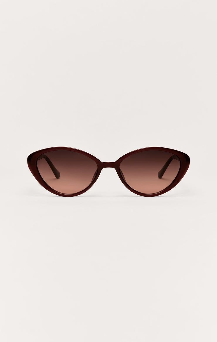Nouveau polarized sunglasses with burgundy frame and reddish tinted lenses