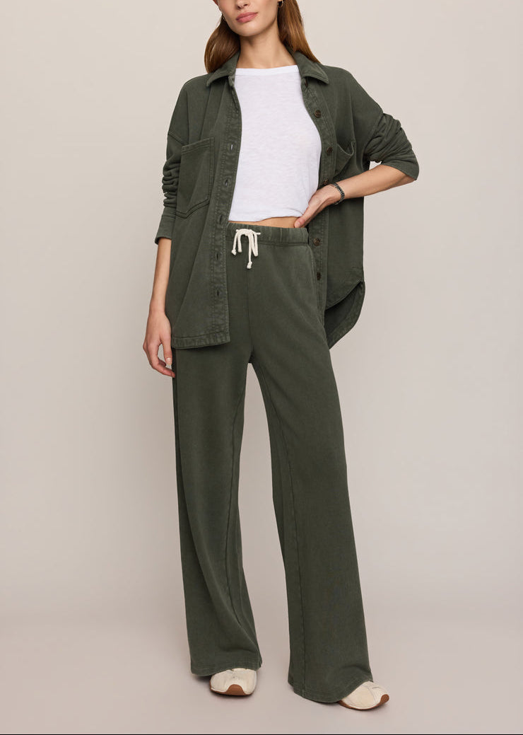 Dark olive knit jacket worn with drawstring waist knit pants