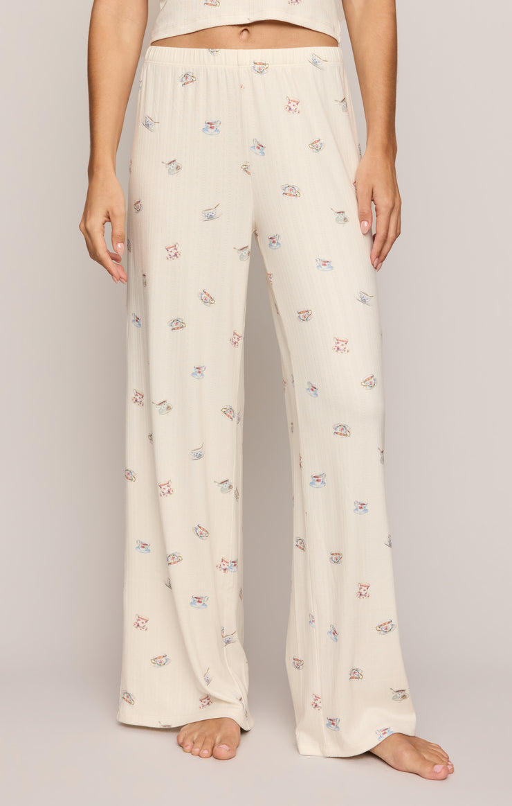 Cream pajama pants with allover tea cup print, wide-leg fit and elastic waistband