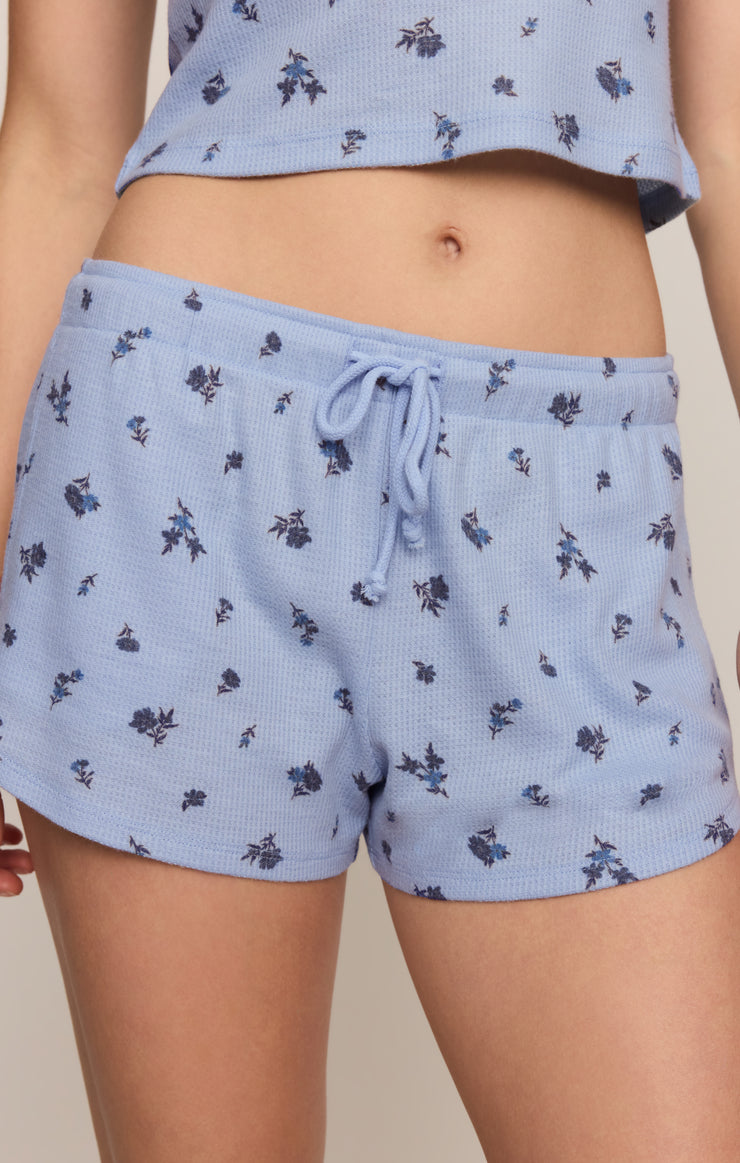 Light blue ditsy print drawstring shorts with elastic waistband close-up