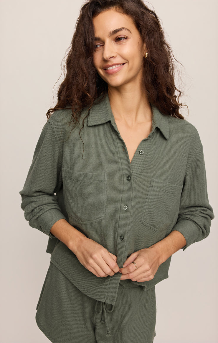 Dark green button-up thermal shirt with collar, long sleeves, and chest pockets
