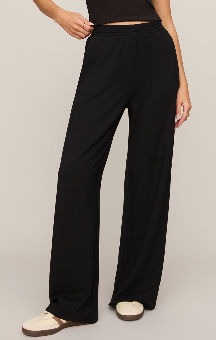 Black wide-leg modal pants with elastic waistband and high-rise fit.