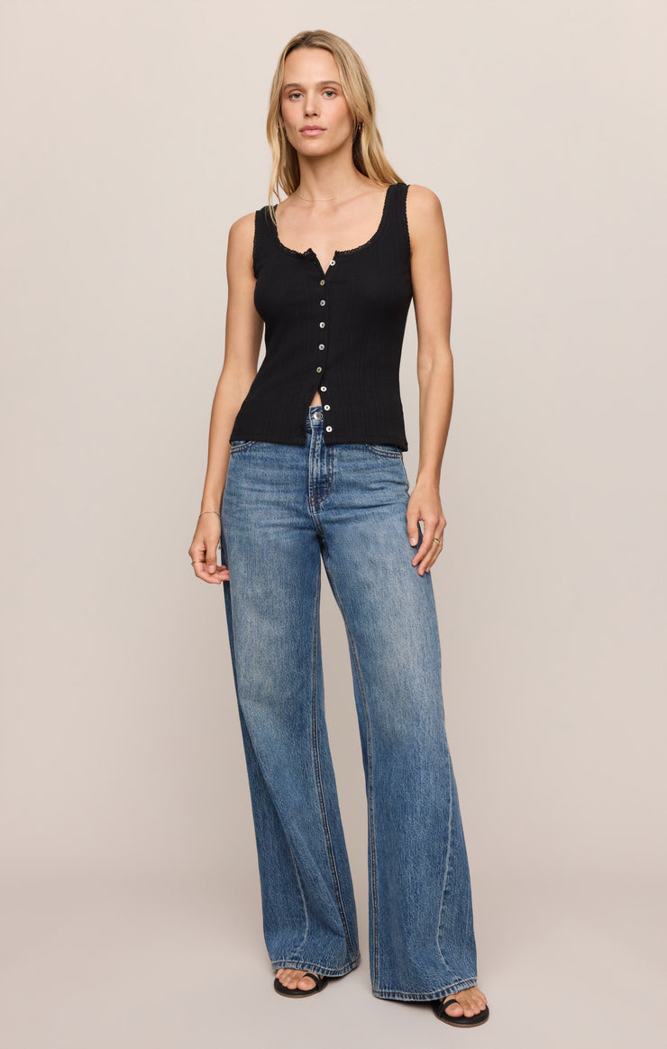 Black sleeveless knit tank with front button placket and scalloped neckline.