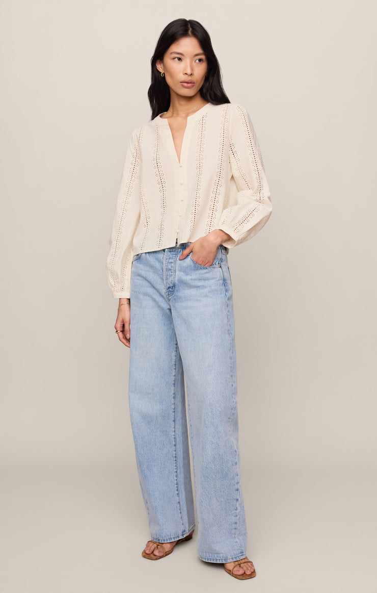 Off-white embroidered button-up top with V-neck and long puff sleeves, relaxed fit