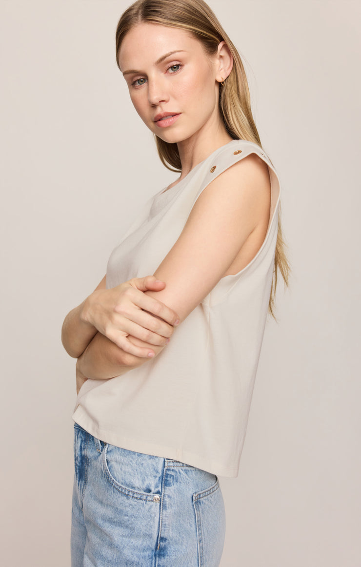 Sandstone cap-sleeve top with grommet shoulder eyelets and relaxed fit