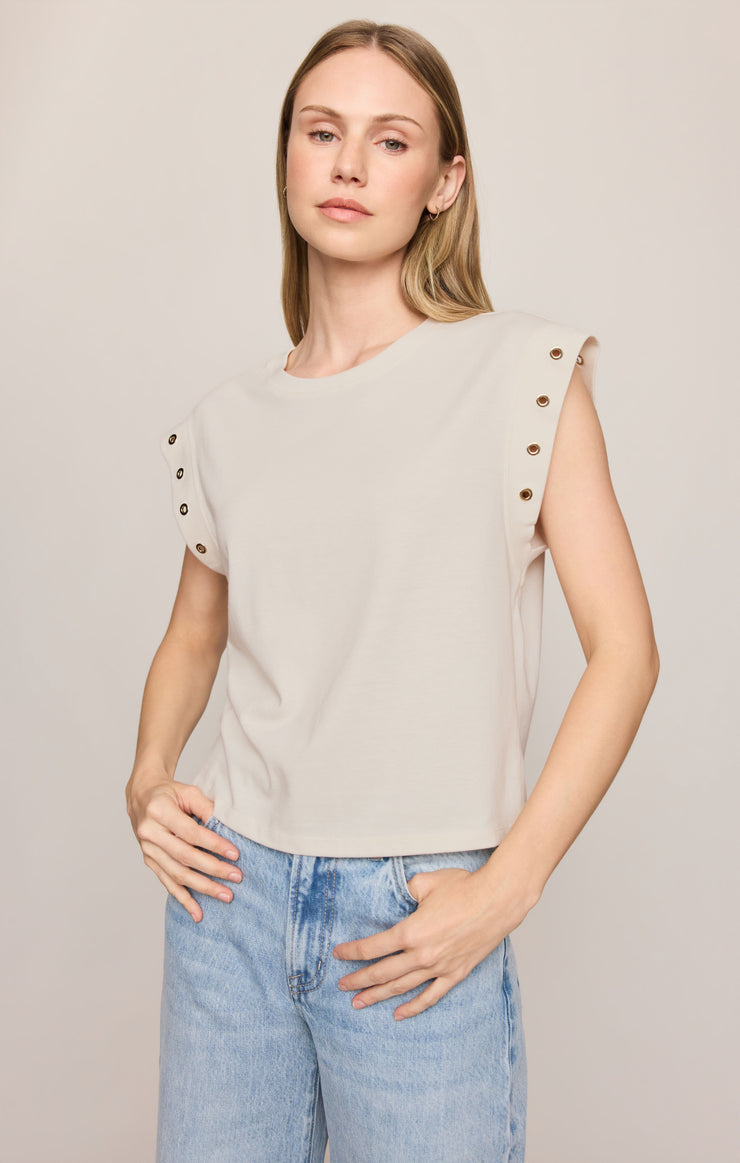Sandstone grommet cap-sleeve top with crew neckline and eyelet shoulder buttons